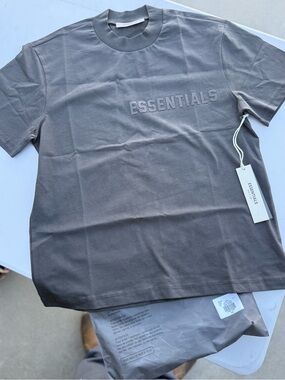 ESSENTIALS Logo Tee in Off black